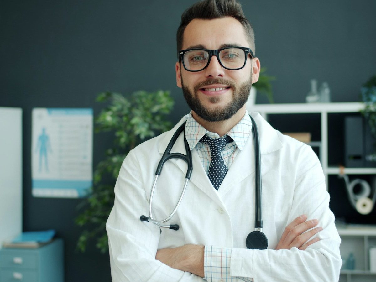 A smiling doctor with a stethoscope
